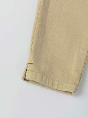 PANTS WITH SEAM DETAIL AND BEIGE POCKETS