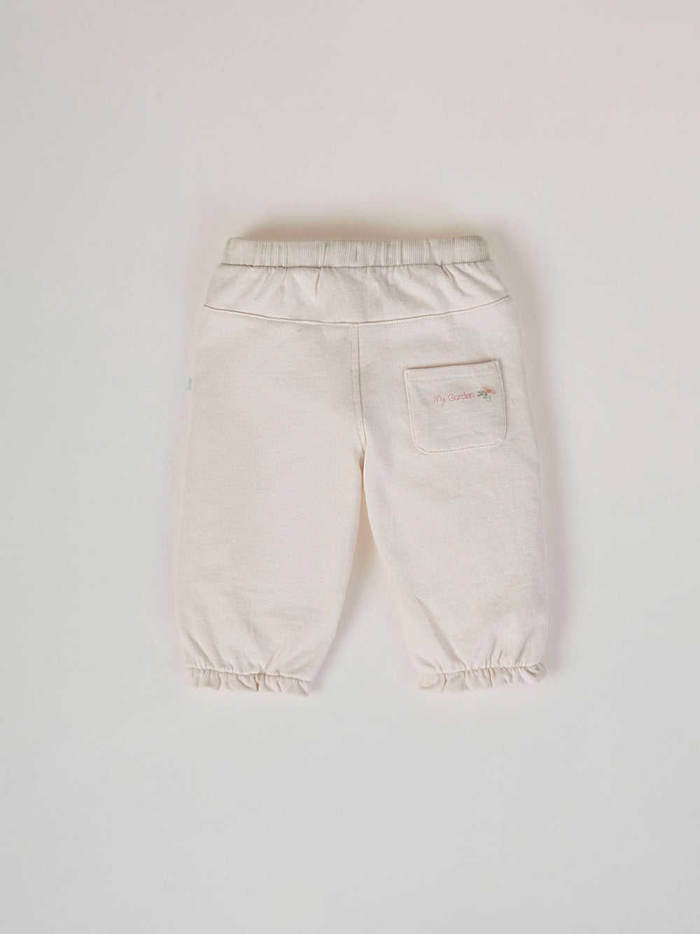 PANTALÓN DE FELPA GOMAS VOLANTE BEIGE