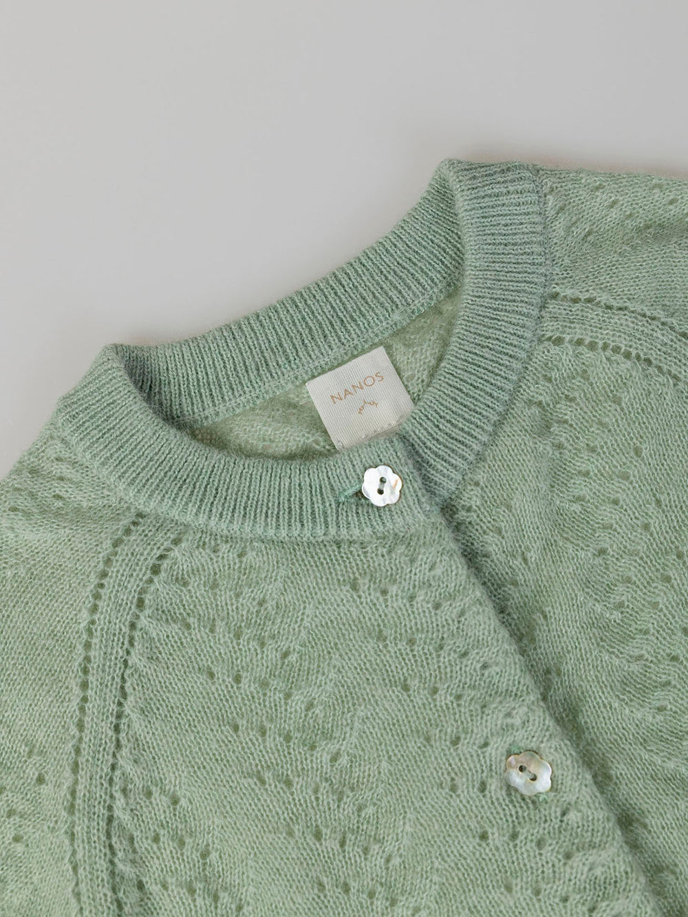 OPENWORK KNITTED CARDIGAN WITH LIGHT GREEN RAGLAN SLEEVES